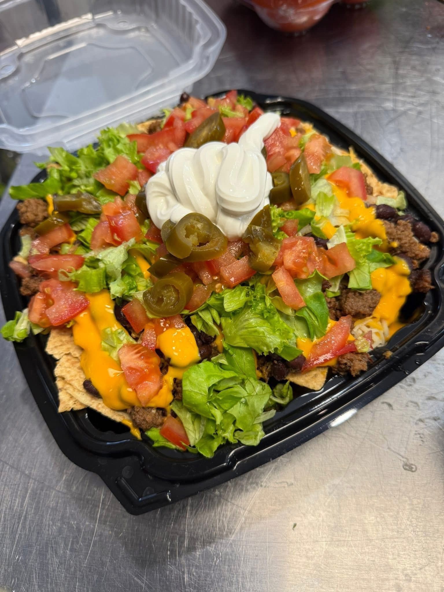 Loaded nachos with toppings at Gladys' Grille