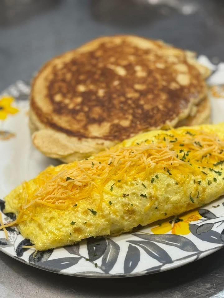 Fluffy pancakes and herb omelet breakfast plate